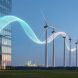 Twilight scene showing Canadian wind turbines and a modern building facade with a subtle light ribbon symbolizing renewable energy credits.